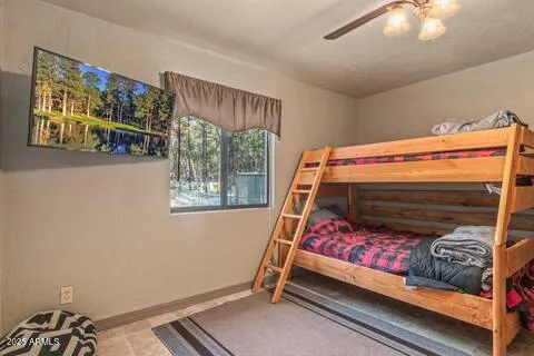 a bed room with a bed and a window