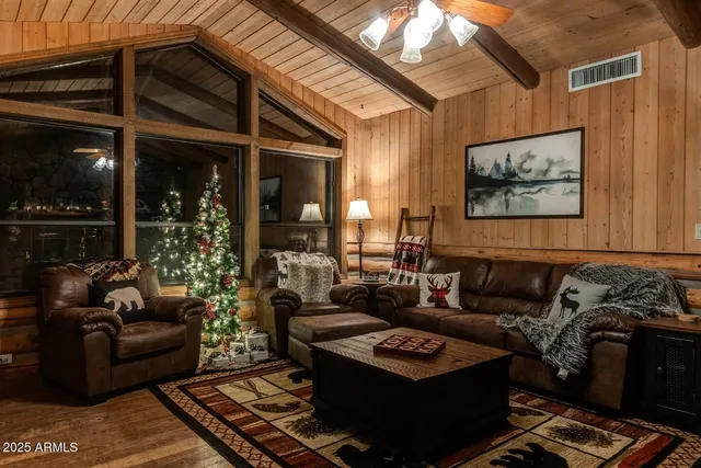 a living room with furniture and a rug