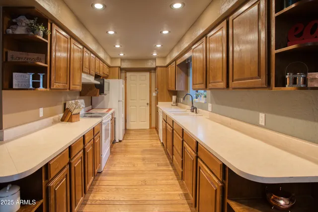 a bathroom with a sink a mirror and a vanity