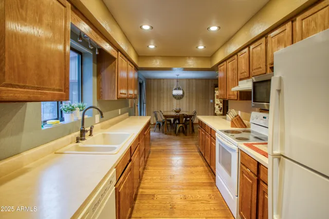a dining hall with stainless steel appliances granite countertop lots of counter top space