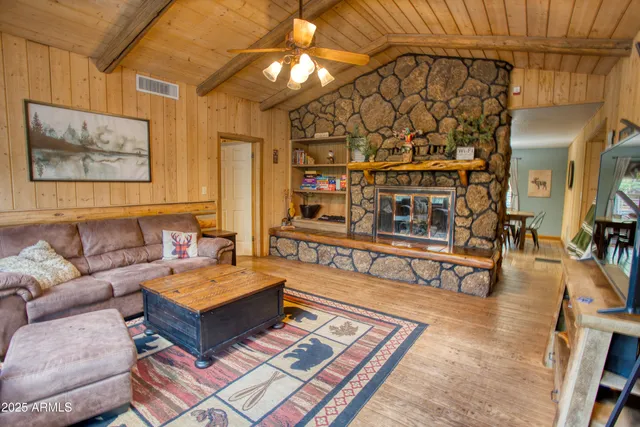 a living room with lots of furniture and a rug