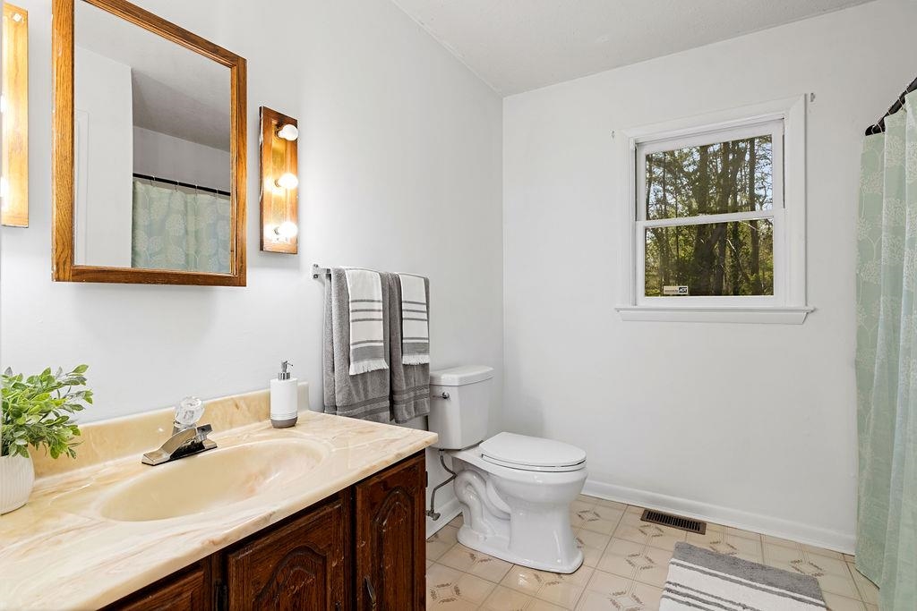 2051 Mt Torrey Road Lyndhurst, VA 22952 - Photo 40 of 67 a bathroom with a granite countertop sink vanity mirror and toilet