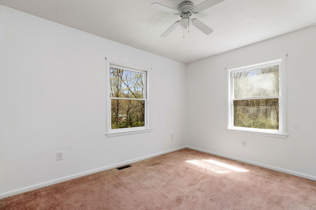 2051 Mt Torrey Road Lyndhurst, VA 22952 - Photo 43 of 67 an empty room with windows and fan