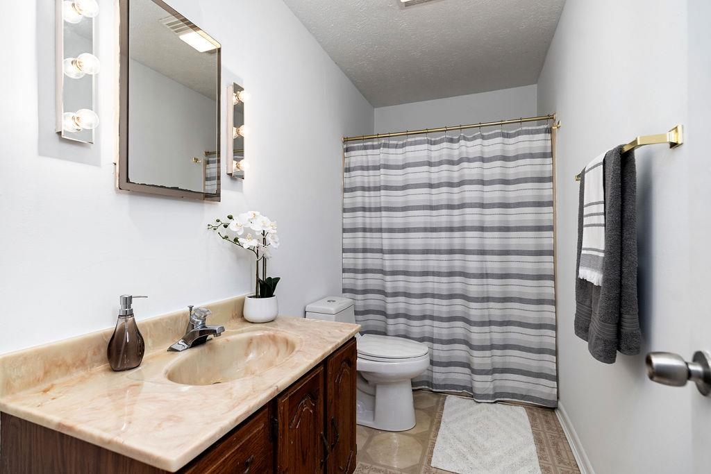 2051 Mt Torrey Road Lyndhurst, VA 22952 - Photo 47 of 67 a bathroom with a sink toilet and shower