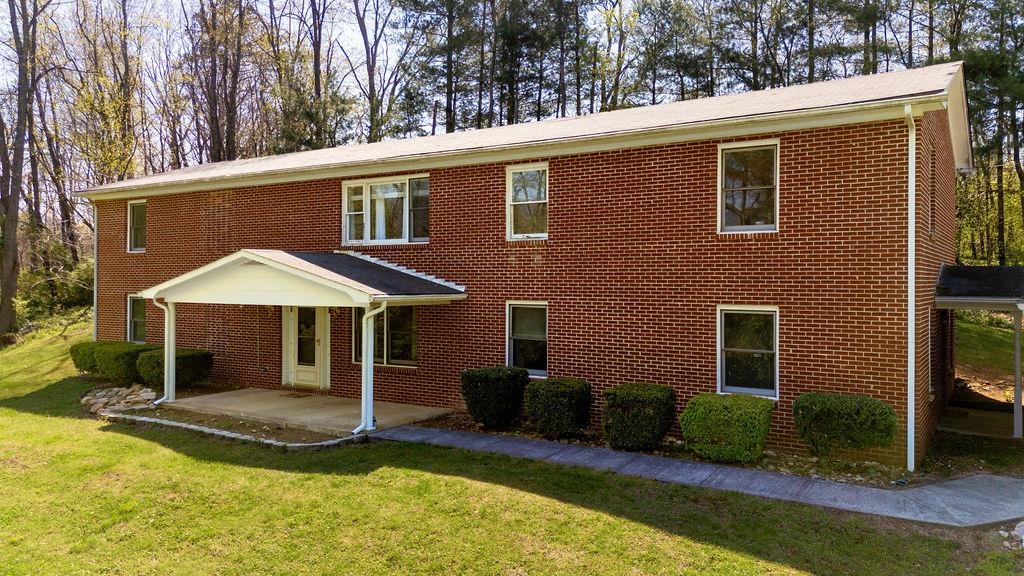 2051 Mt Torrey Road Lyndhurst, VA 22952 - Photo 5 of 67 a view of a house with a yard and lawn chairs under an umbrella