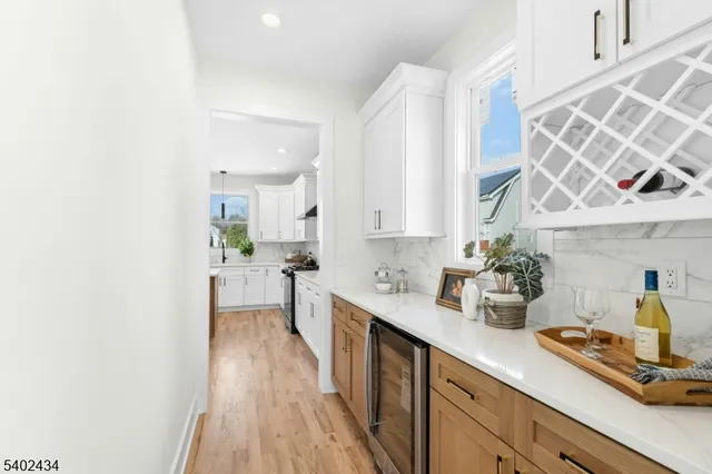 a kitchen with a sink a stove and cabinets