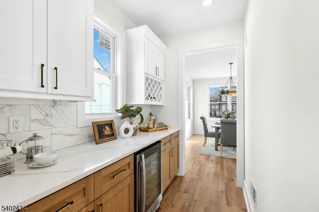 a kitchen with sink and cabinets