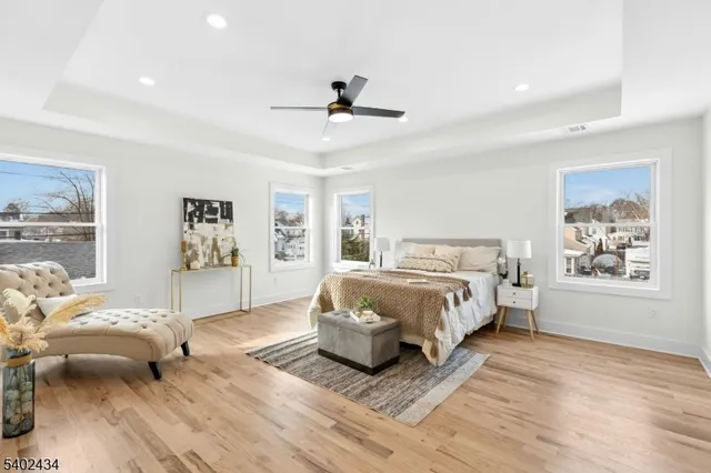 a spacious bedroom with a large bed and a window