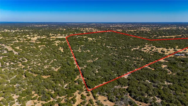 an aerial view of a house with a garden