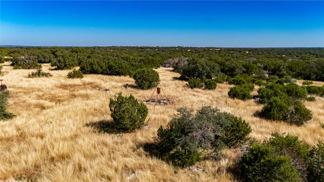a view of a large body of water with a building in background
