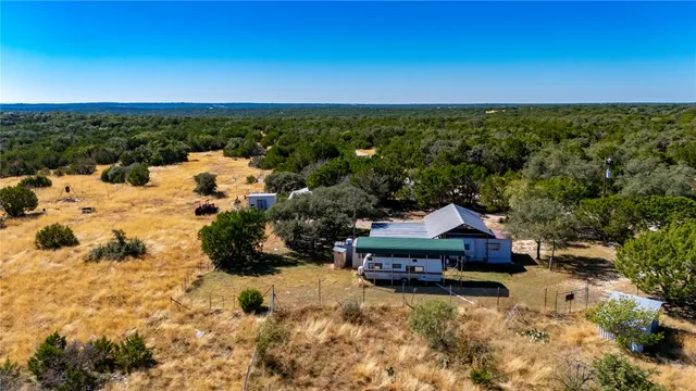 a aerial view of a house with a yard