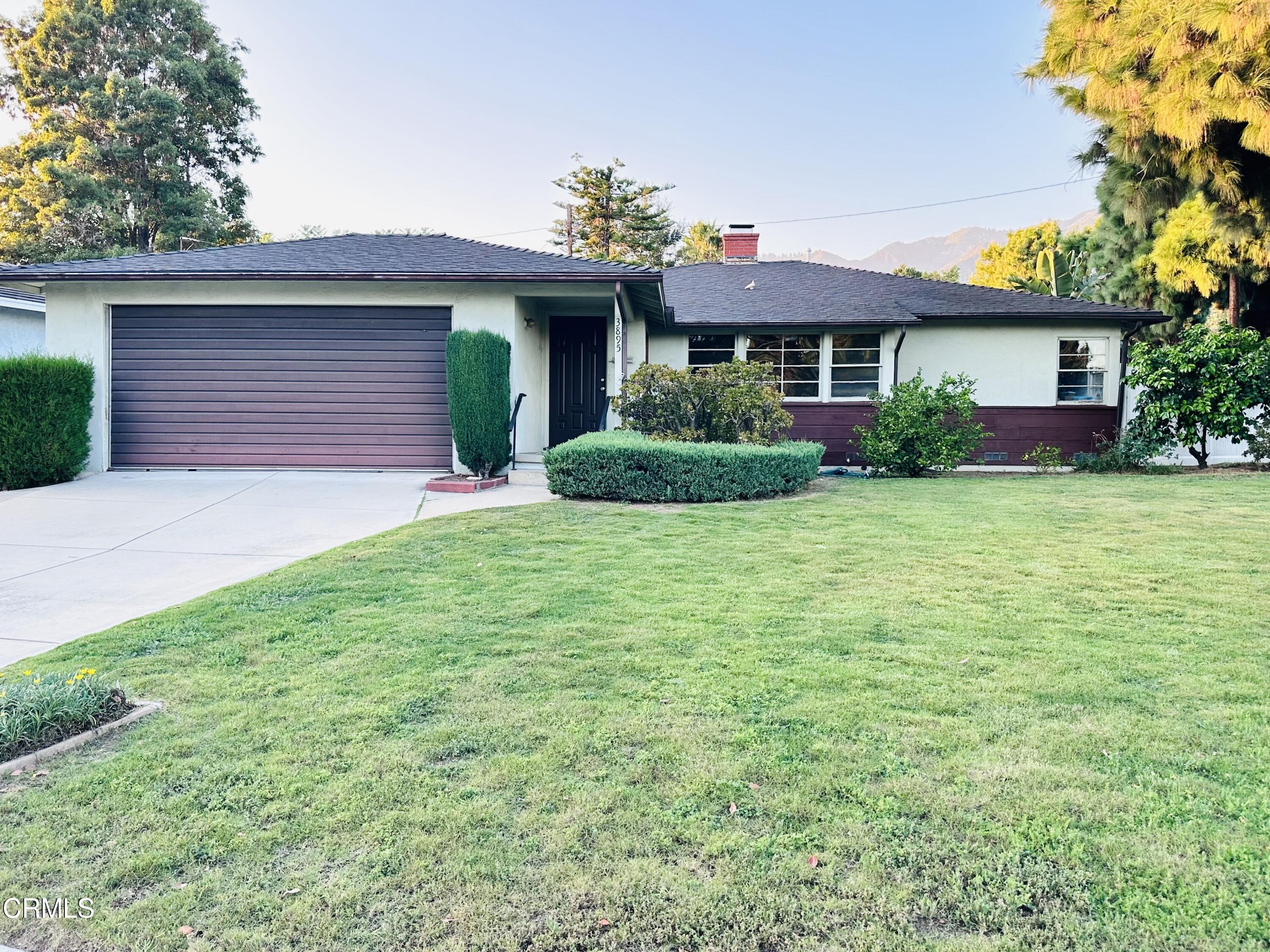 3895 Mayfair Drive Pasadena, CA 91107 - Photo 1 of 18 a front view of a house with a yard and garage