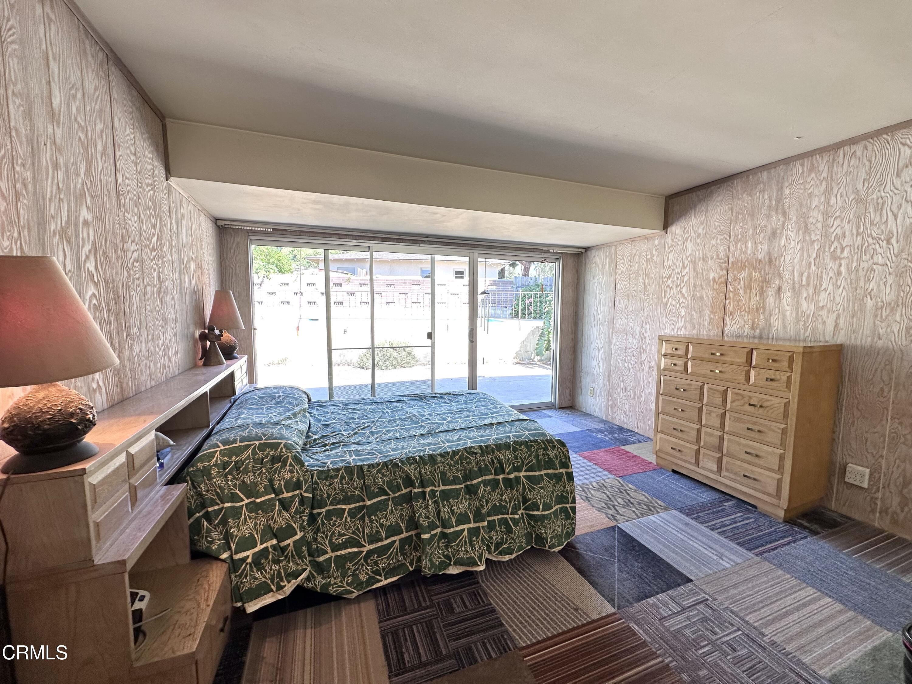 3895 Mayfair Drive Pasadena, CA 91107 - Photo 12 of 18 a bedroom with a bed and wooden floor