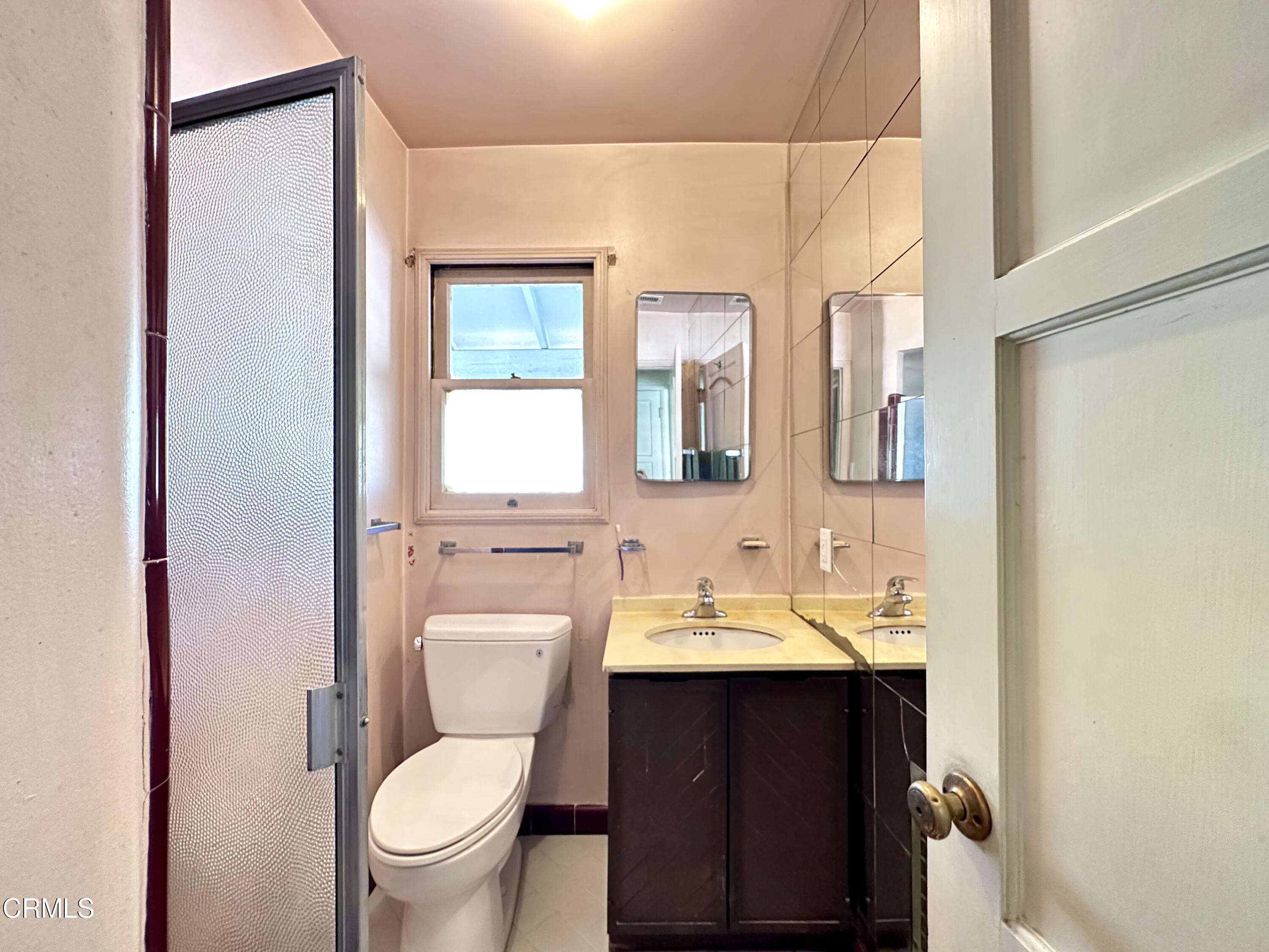 3895 Mayfair Drive Pasadena, CA 91107 - Photo 15 of 18 a bathroom with a toilet sink shower and mirror