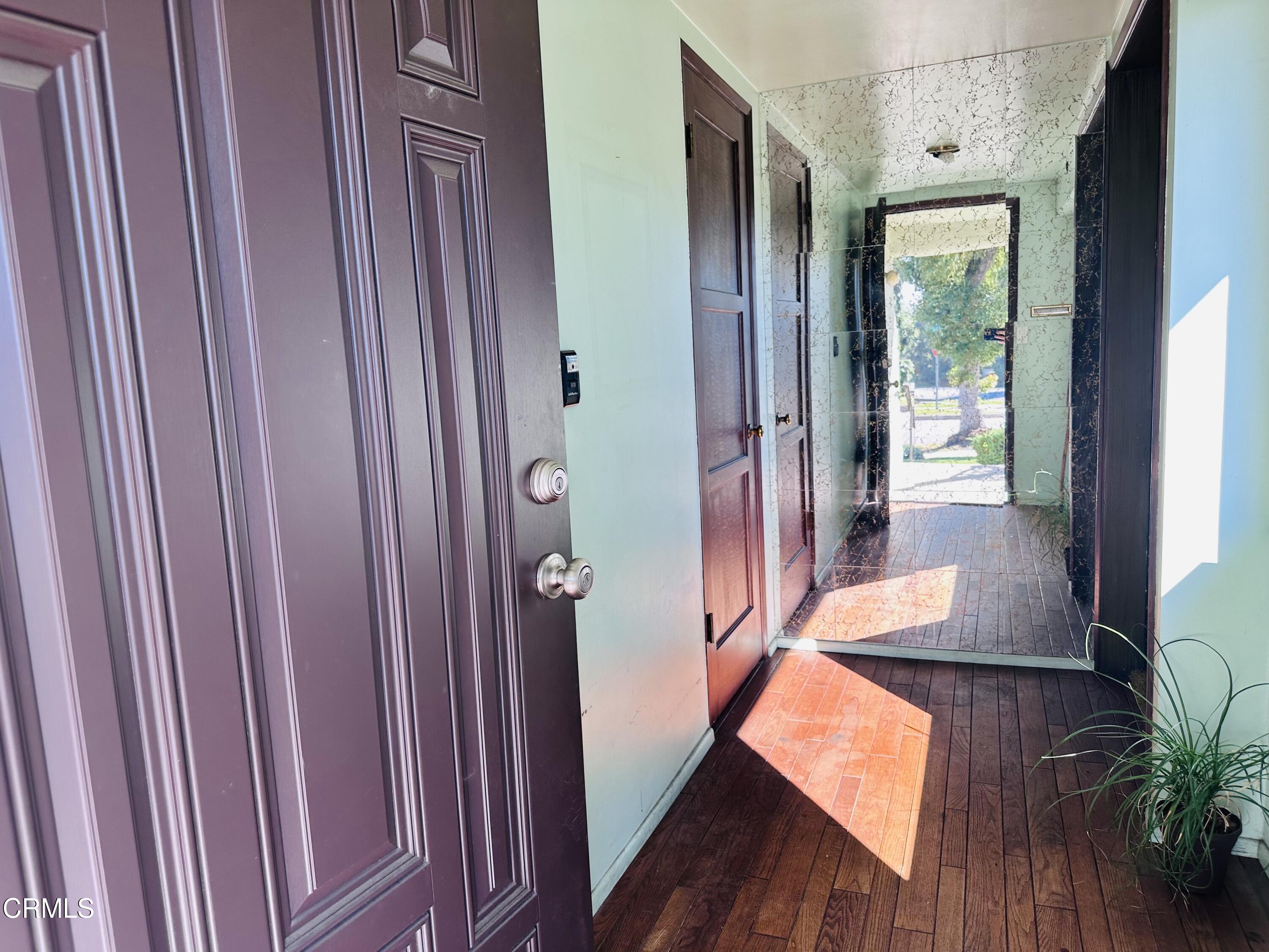3895 Mayfair Drive Pasadena, CA 91107 - Photo 2 of 18 a view of a hallway with wooden floor and stairs