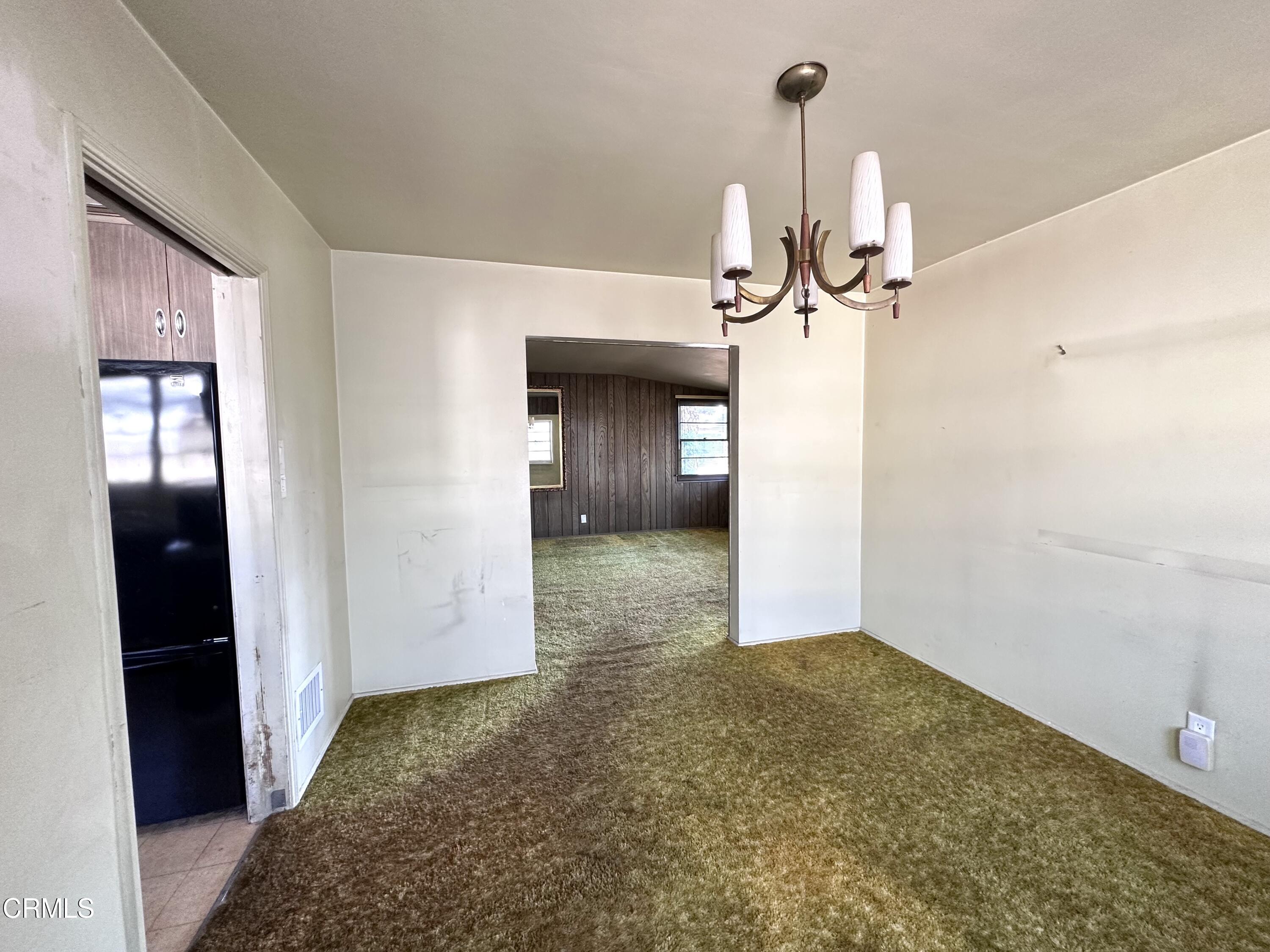 3895 Mayfair Drive Pasadena, CA 91107 - Photo 7 of 18 a view of a big room with chandelier fan and windows