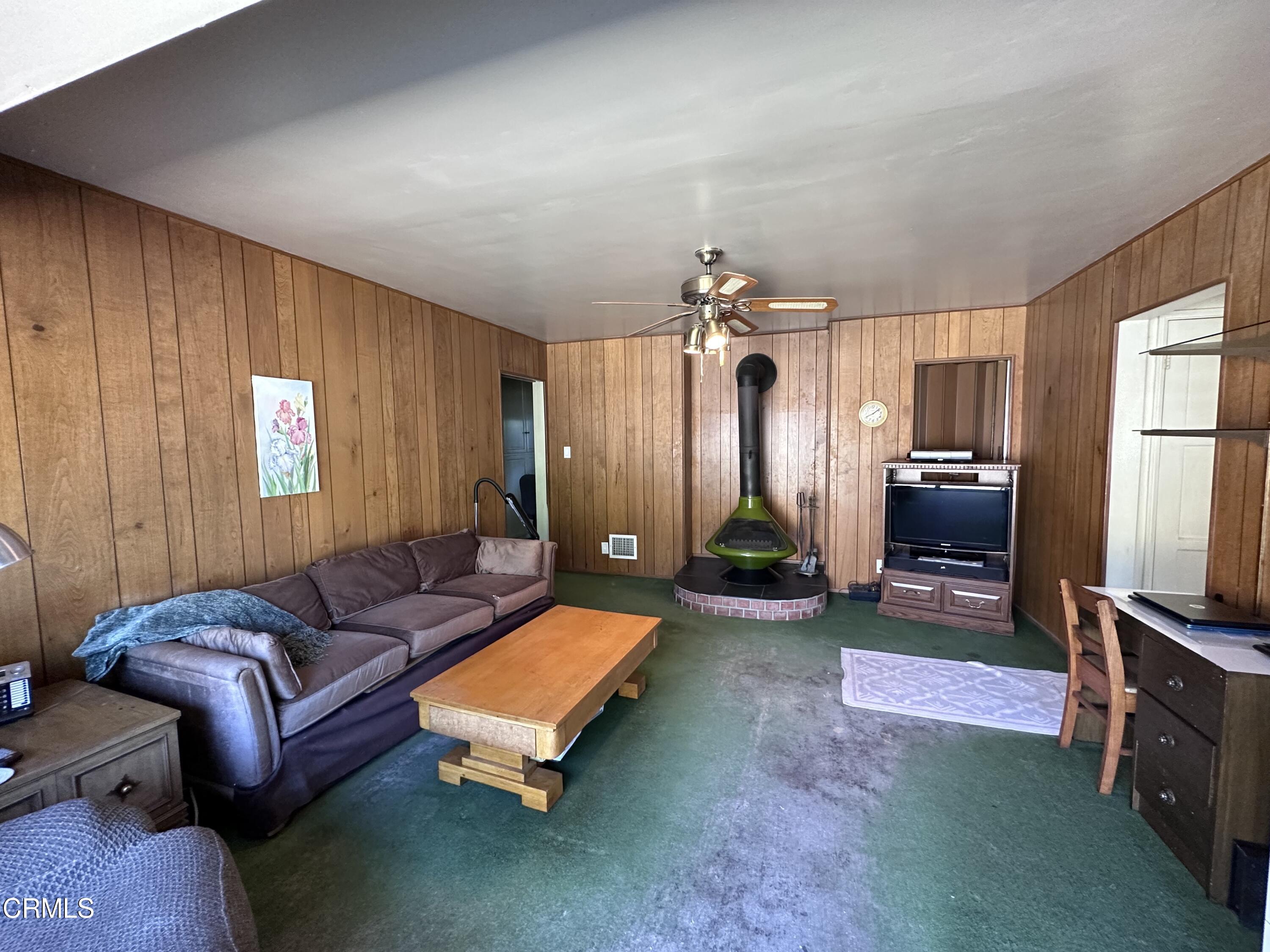 3895 Mayfair Drive Pasadena, CA 91107 - Photo 8 of 18 a living room with furniture a flat screen tv and a window