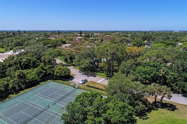 an aerial view of a house with a yard