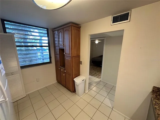 a view of a walk in closet and bathroom