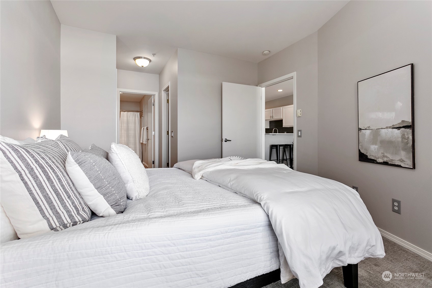 1011 Bancroft Street, Unit 303 Bellingham, WA 98225 - Photo 19 of 40 a bedroom with a bed and painting on the wall
