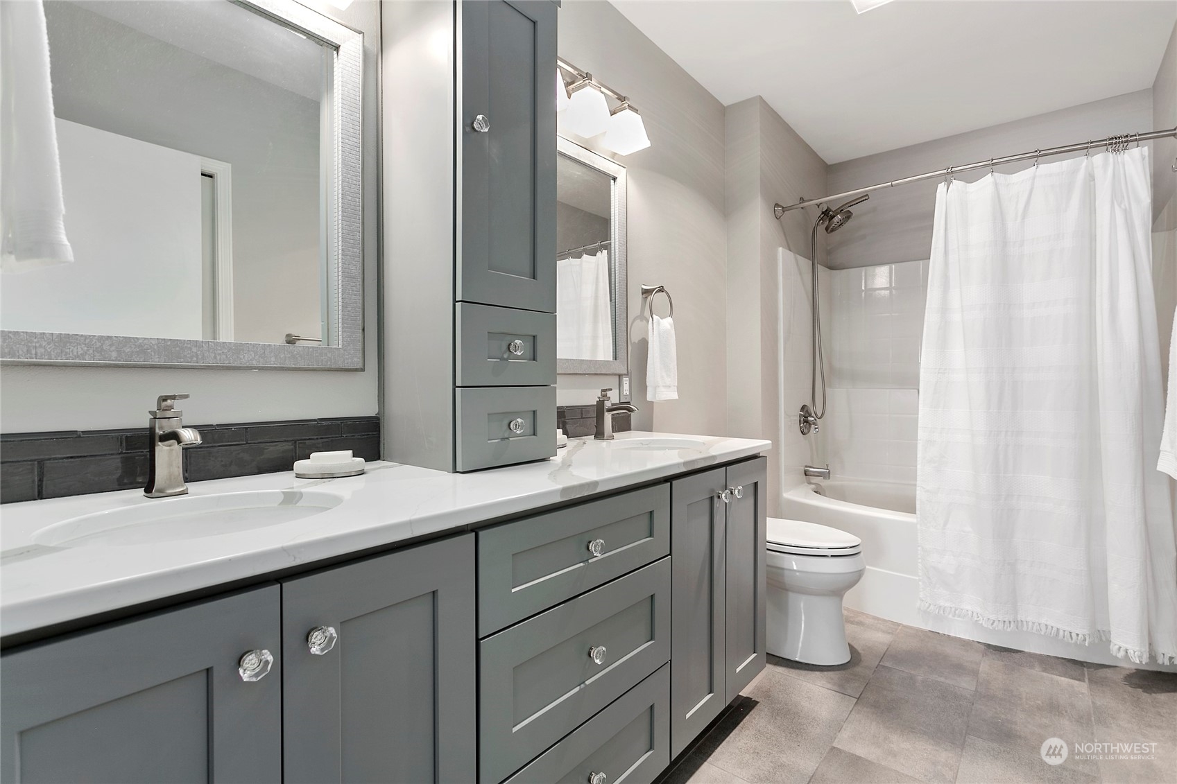 1011 Bancroft Street, Unit 303 Bellingham, WA 98225 - Photo 21 of 40 a bathroom with a double vanity sink toilet and a mirror