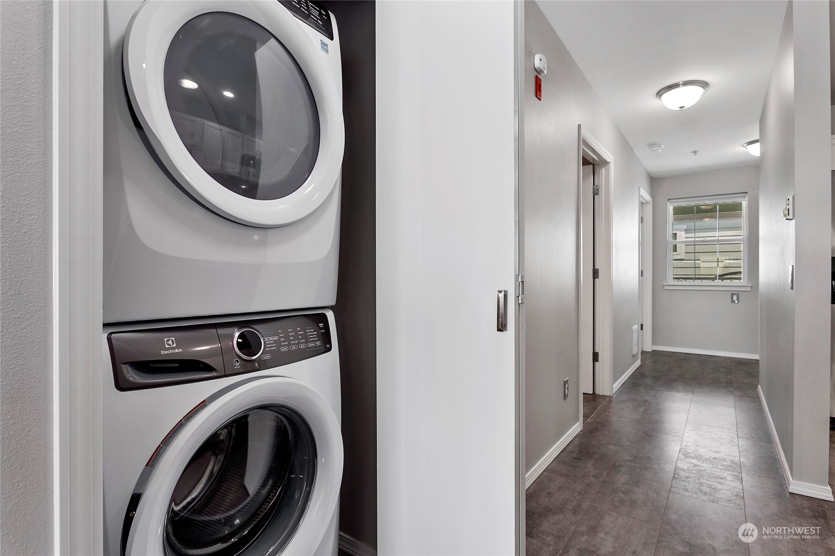 1011 Bancroft Street, Unit 303 Bellingham, WA 98225 - Photo 24 of 40 a view of a hallway with washer and dryer