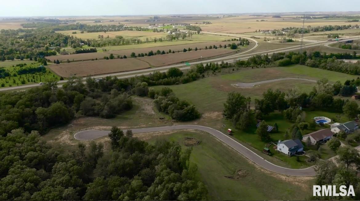 326 Silver Creek Road De Witt, IA 52742 - Photo 2 of 7 an aerial view of a city with mountains