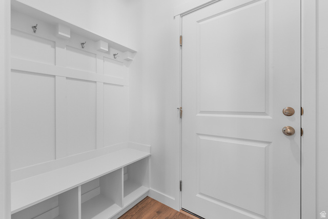 788 West 2840 South, Unit 2 Logan, UT 84321 - Photo 11 of 21 Entryway mudroom featuring a built-in bench with storage cubbies and wall-mounted coat hooks