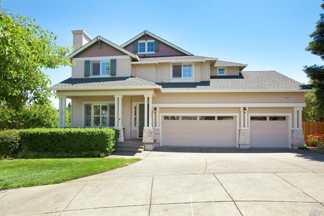 1400 Owl Point Santa Rosa, CA 95409 - Photo 1 of 1 a front view of a house with a garden and garage
