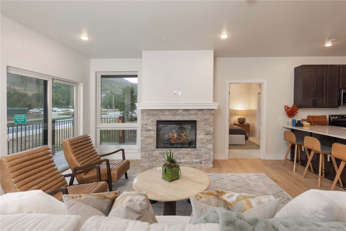 125 West Keystone Road, Unit 301 Keystone, CO 80435 - Photo 14 of 23 a living room with furniture and a fireplace