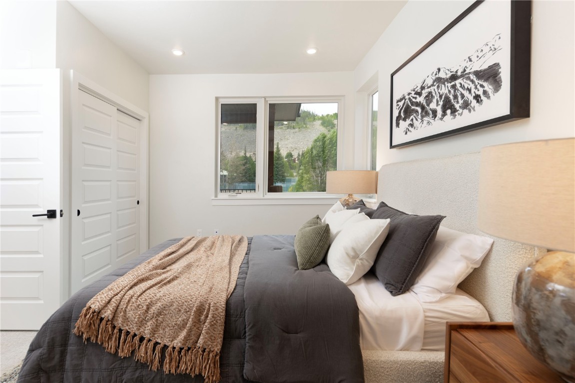 125 West Keystone Road, Unit 301 Keystone, CO 80435 - Photo 18 of 23 a bedroom with a bed and window