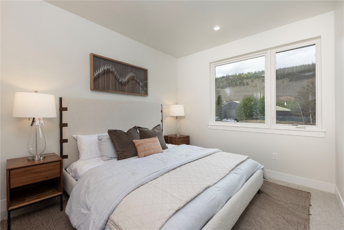 125 West Keystone Road, Unit 301 Keystone, CO 80435 - Photo 19 of 23 a bedroom with a bed and a window