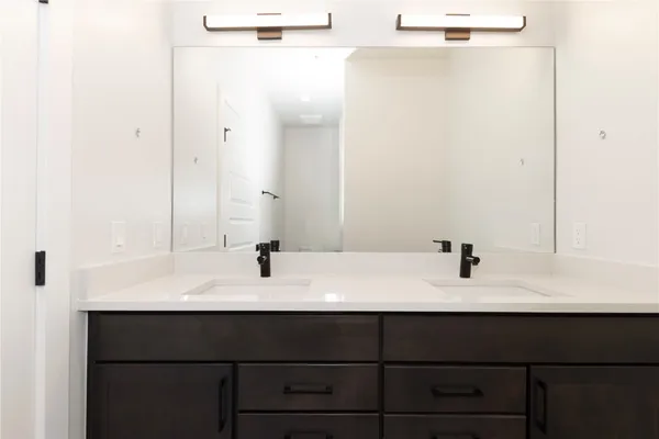 a bathroom with a sink and mirror