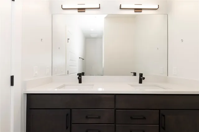 a bathroom with a sink and mirror