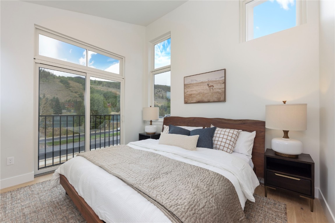 125 West Keystone Road, Unit 301 Keystone, CO 80435 - Photo 7 of 23 a bedroom with a large bed and a large window