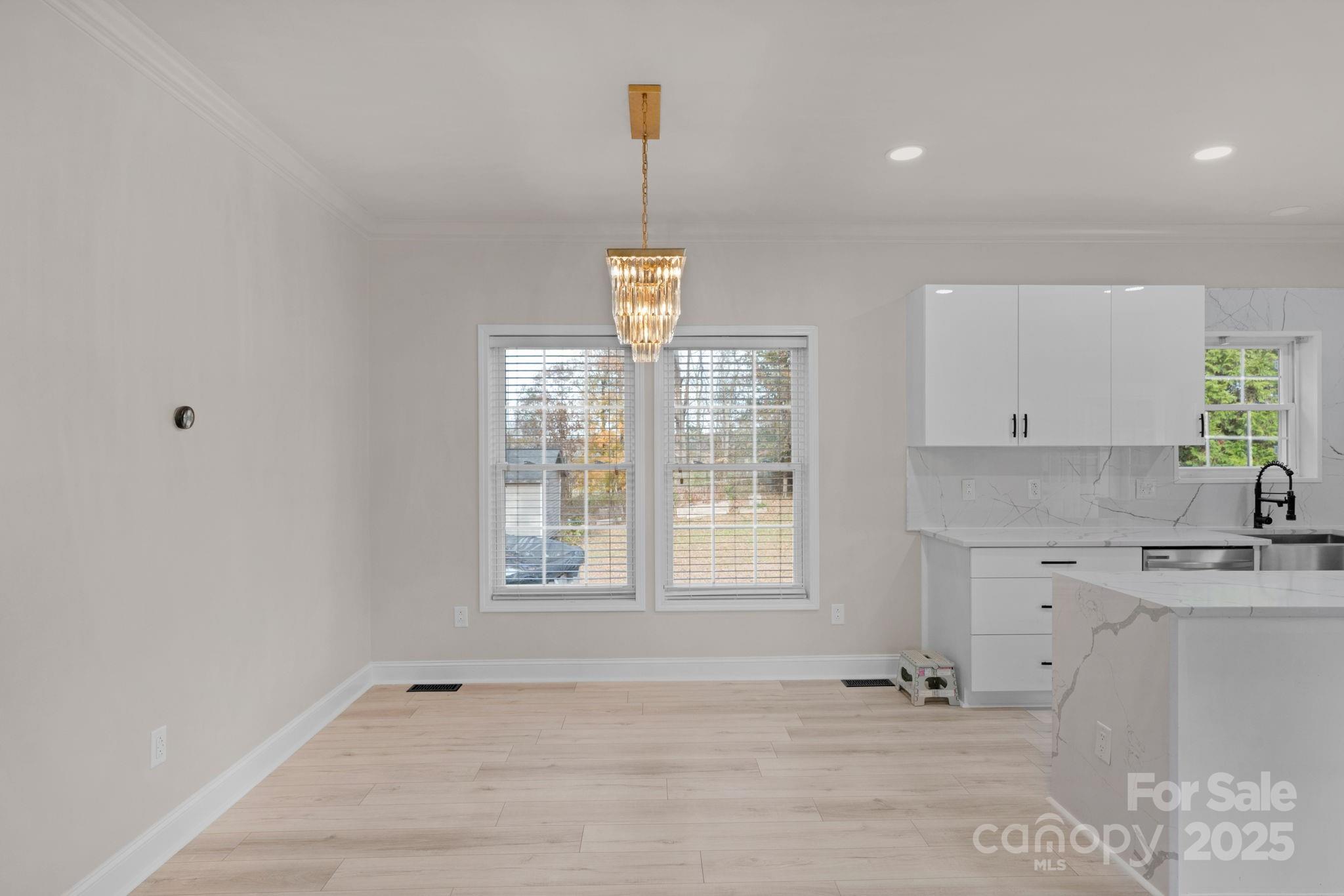 8891 Rock Hole Road Stanfield, NC 28163 - Photo 11 of 35 a view of a kitchen with granite countertop cabinets and a window