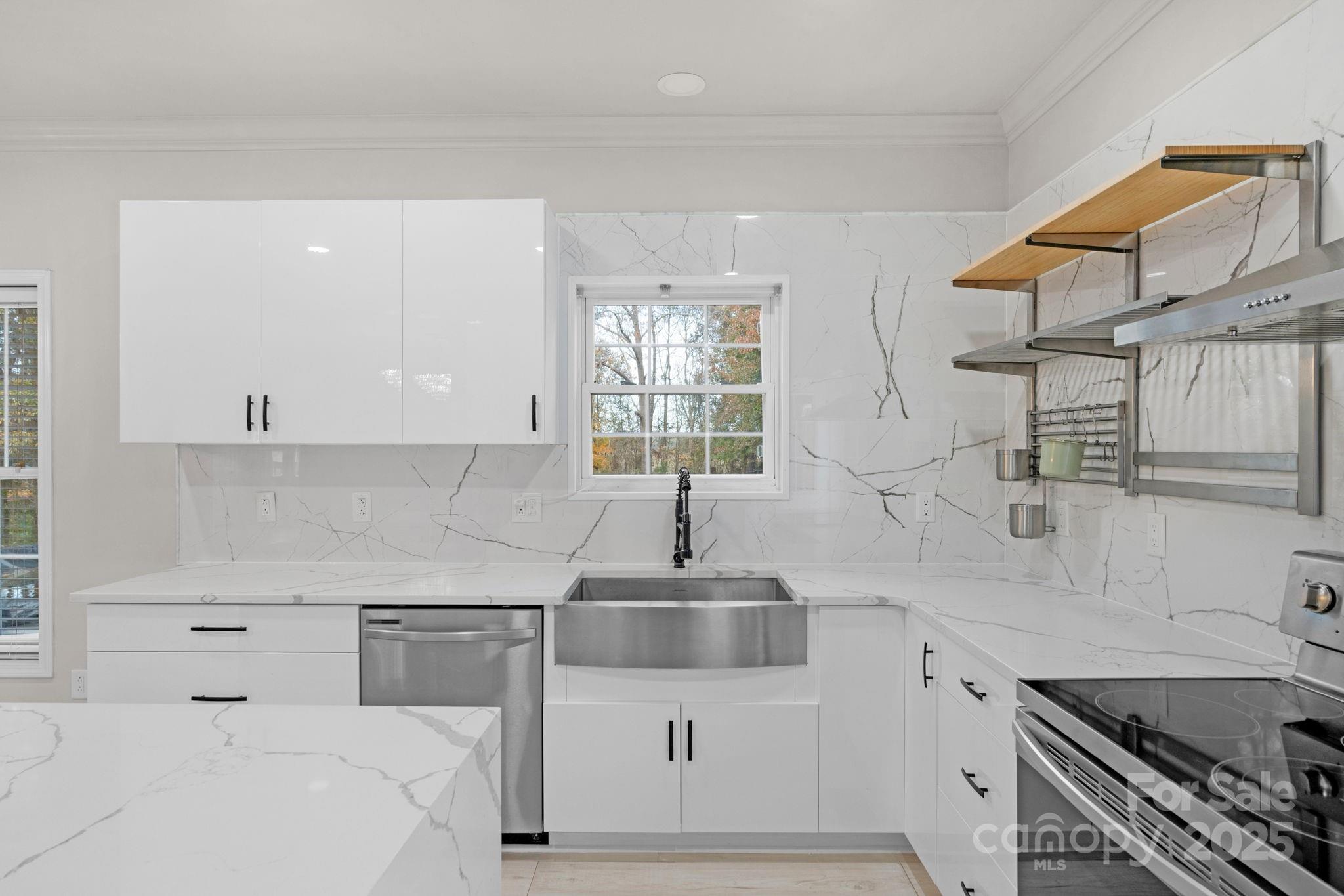 8891 Rock Hole Road Stanfield, NC 28163 - Photo 14 of 35 a kitchen with a sink cabinets and window