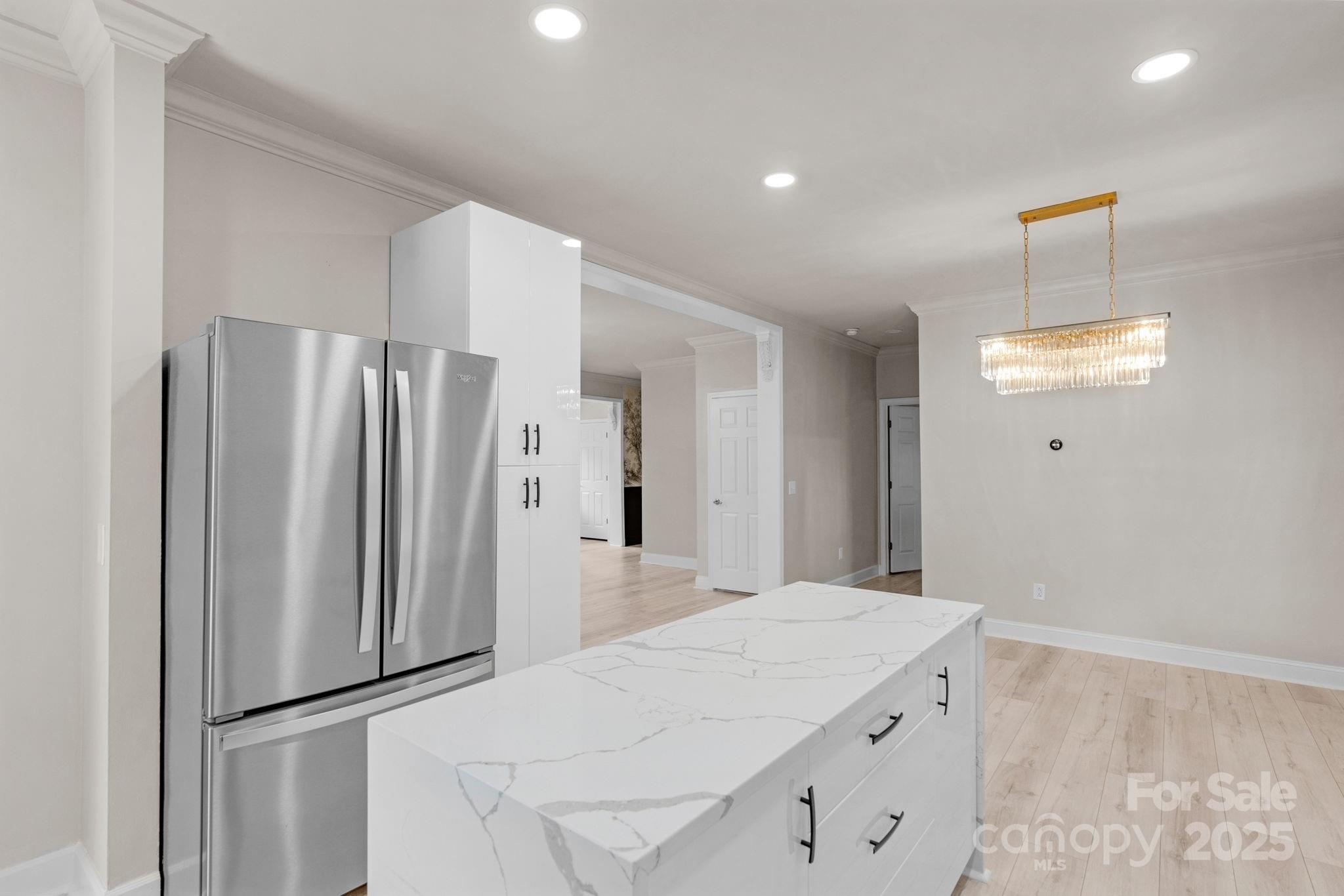 8891 Rock Hole Road Stanfield, NC 28163 - Photo 16 of 35 a kitchen with a refrigerator and countertop