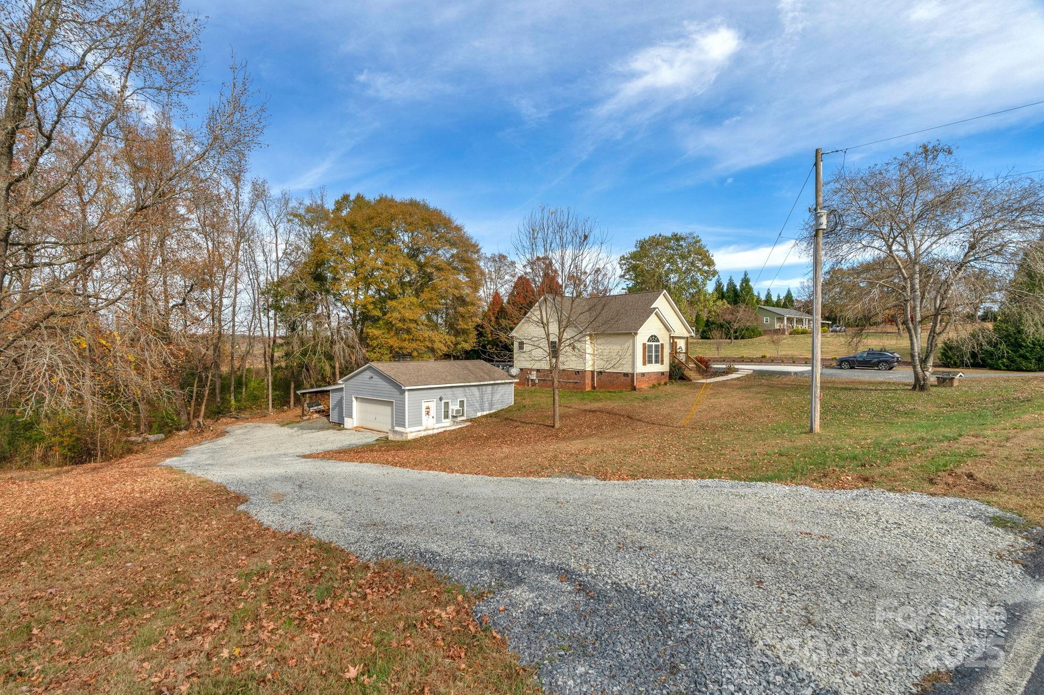 8891 Rock Hole Road Stanfield, NC 28163 - Photo 2 of 35 a view of a park with large trees