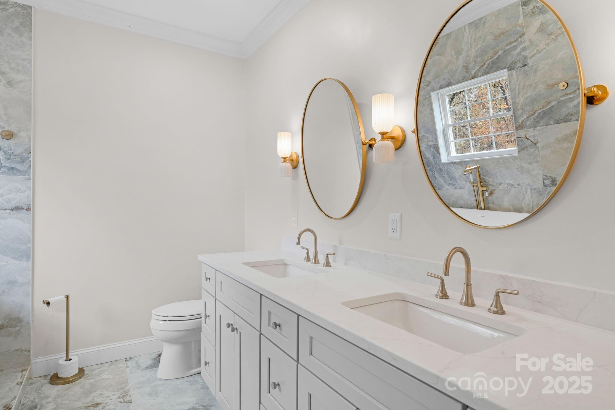 8891 Rock Hole Road Stanfield, NC 28163 - Photo 21 of 35 a bathroom with a sink and a mirror