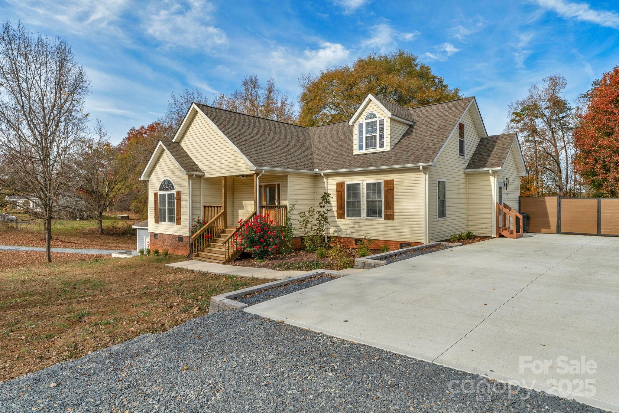 8891 Rock Hole Road Stanfield, NC 28163 - Photo 4 of 35 a view of a yard in front of a house