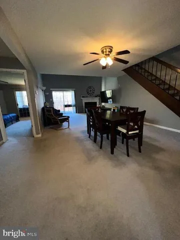 a view of a livingroom with furniture and a chandelier