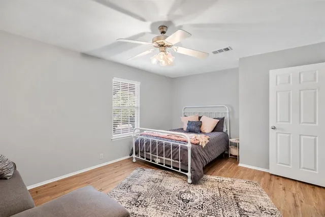 a room with a bed and a window