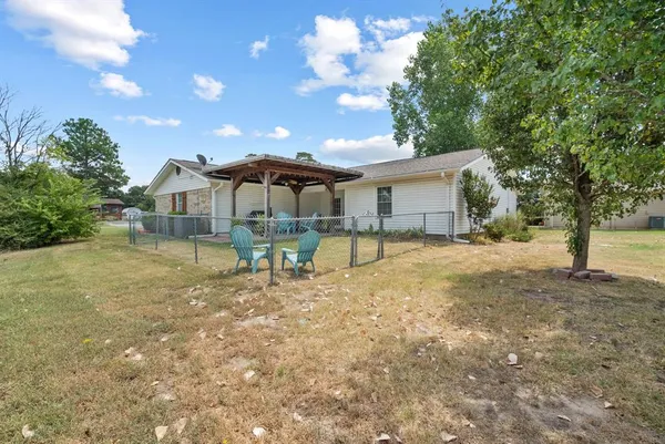 a house view with a backyard space
