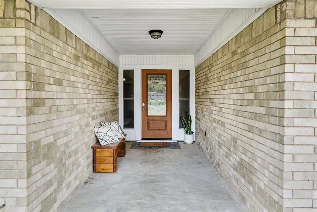 a view of front door of house with an outdoor space