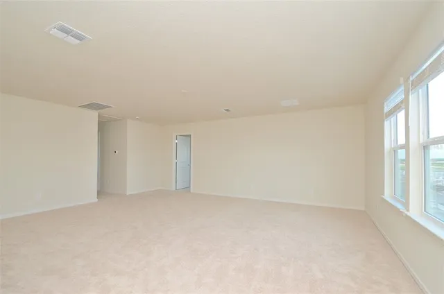 an empty room with windows