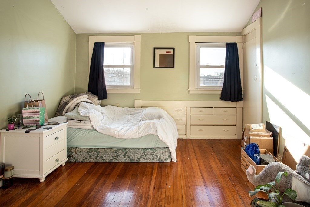 80 State Road North Dartmouth, MA 02747 - Photo 16 of 23 a bedroom with a bed and wooden floor