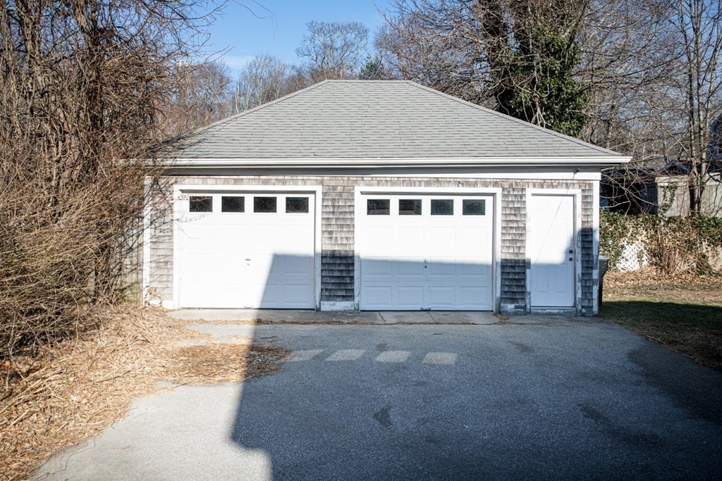 80 State Road North Dartmouth, MA 02747 - Photo 23 of 23 a front view of a house with a yard and garage