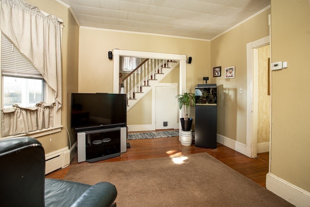 80 State Road North Dartmouth, MA 02747 - Photo 4 of 23 a view of a livingroom with furniture and a flat screen tv