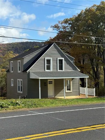 a view of a house with a street